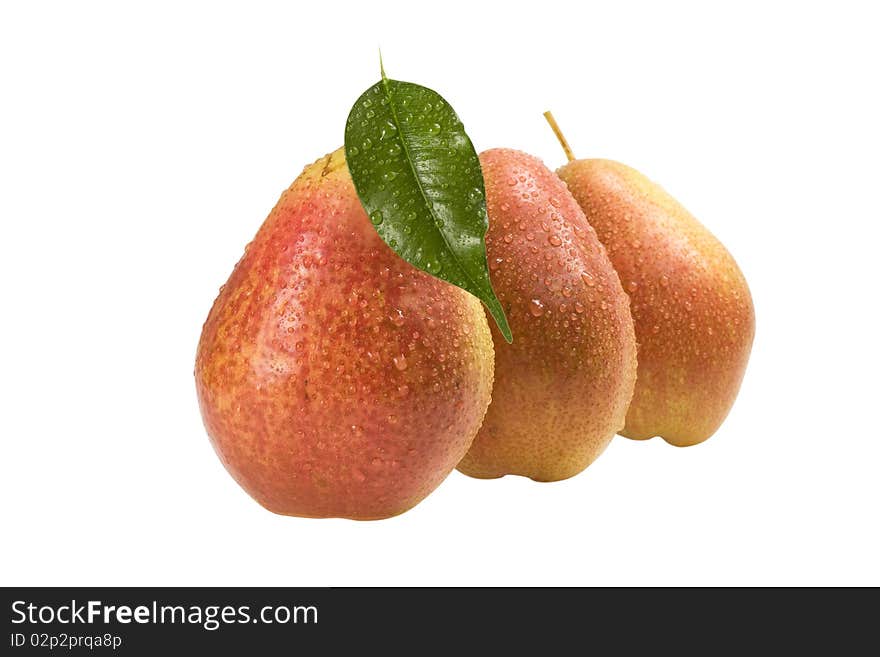 Three Pear With Drops Of Dew On A White