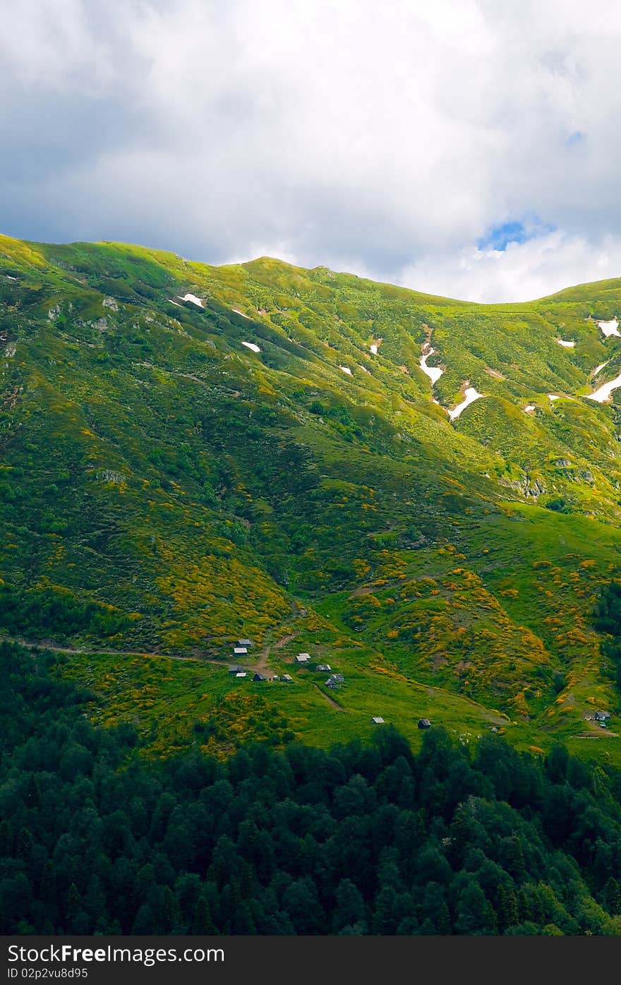 In the mountains there are summer houses to weather the rain. In the mountains there are summer houses to weather the rain