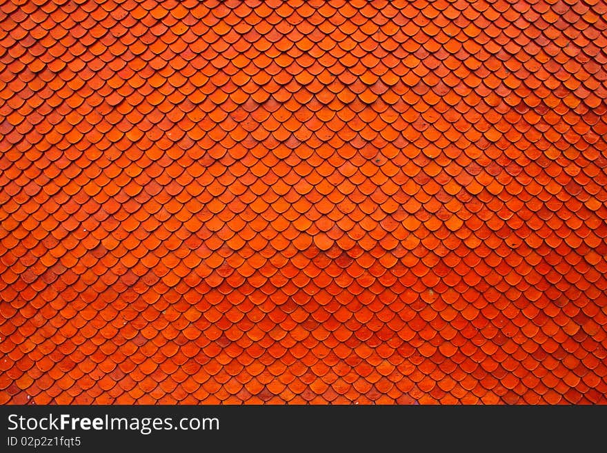 Orange brown clay roof texture in wide shot. Orange brown clay roof texture in wide shot