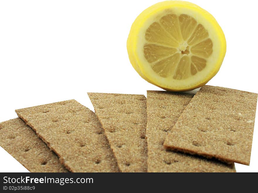 Crackling bread is spread out in the form of a fan, and on it the lemon. Crackling bread is spread out in the form of a fan, and on it the lemon