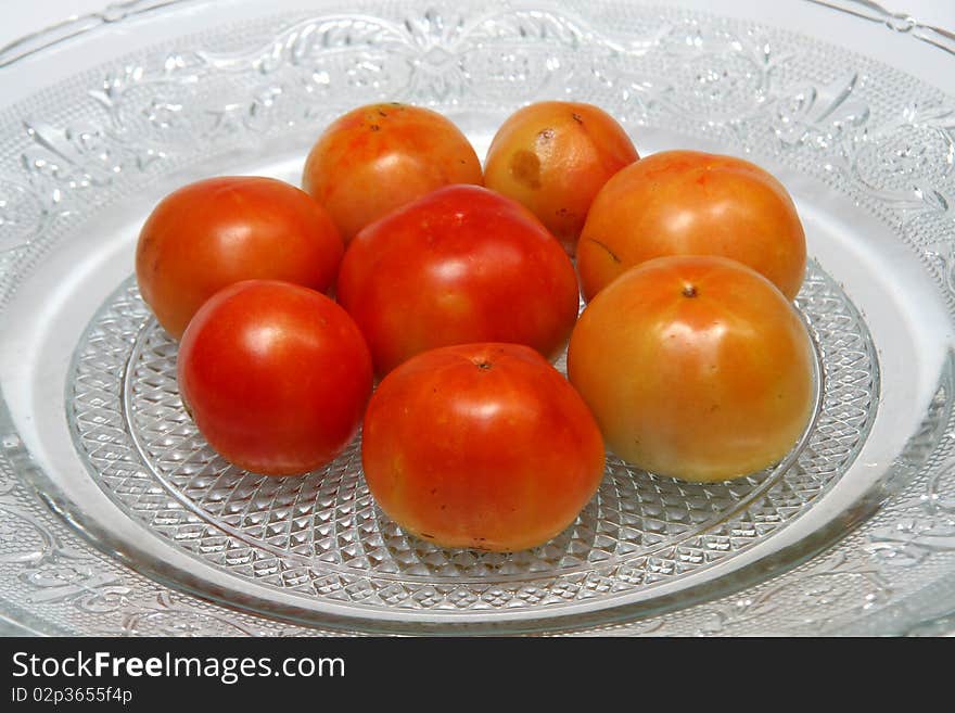 Tomatoes are red, yellow, sour, pulpy edible fruits containing vitamin C and beta-carotene. Tomatoes are red, yellow, sour, pulpy edible fruits containing vitamin C and beta-carotene