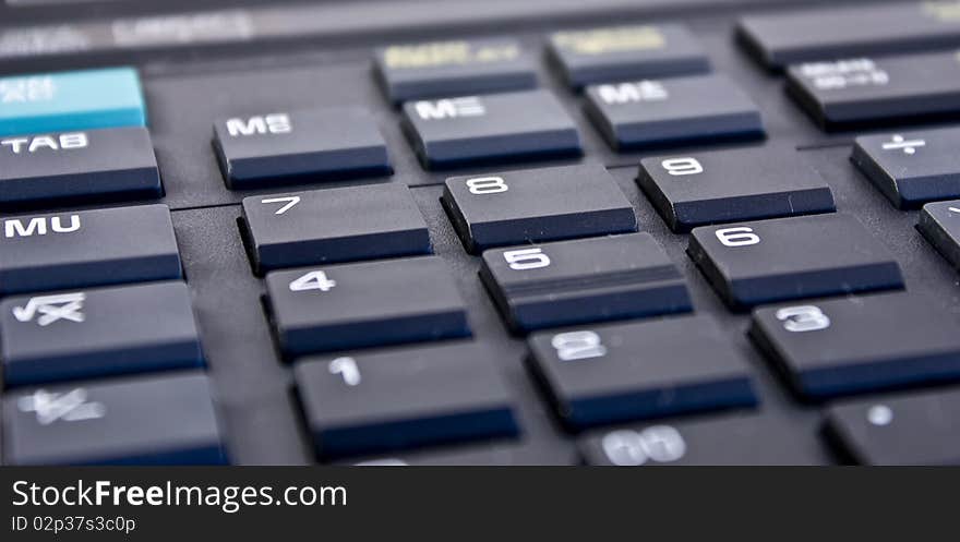 Closeup scene with black electronic calculator keyboard