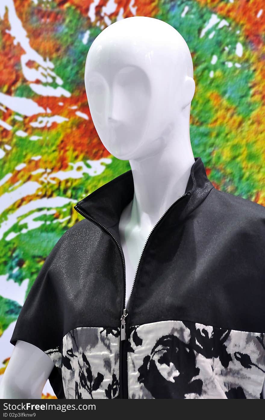 Mannequin in casual design clothing in white and black, in front of colorful background. Mannequin in casual design clothing in white and black, in front of colorful background.