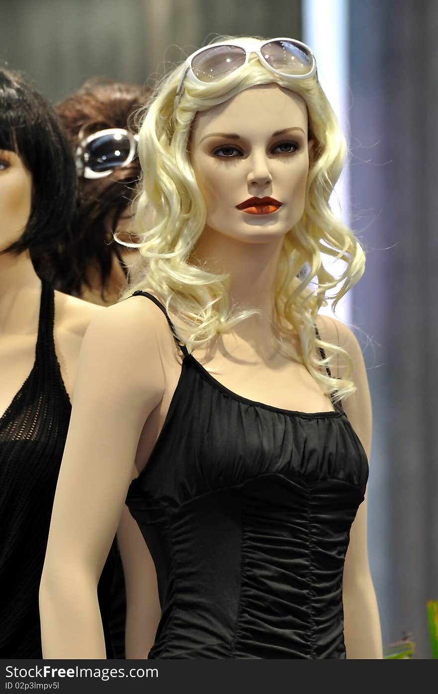 Beautiful female mannequin in fashion show, with casual and sexual design clothing in black.