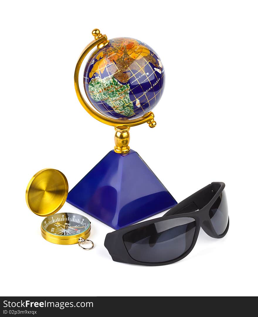 Sunglasses, compass and globe