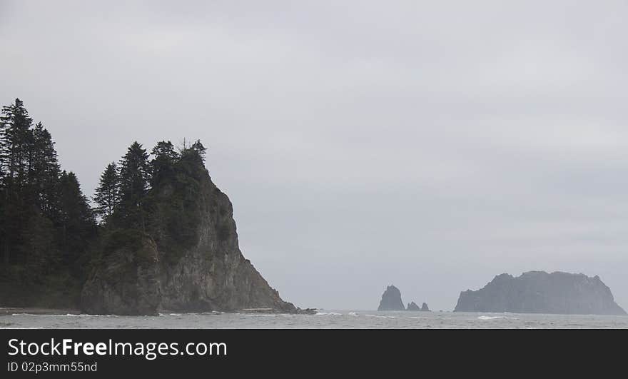 Cliffs and seastacks rising from the surf