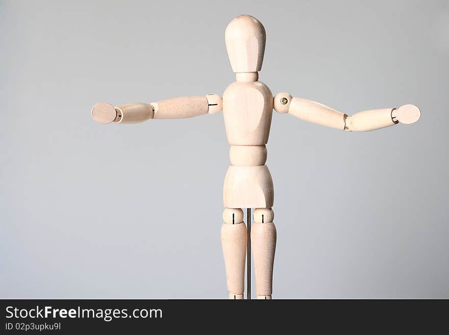 Wooden doll on the white background