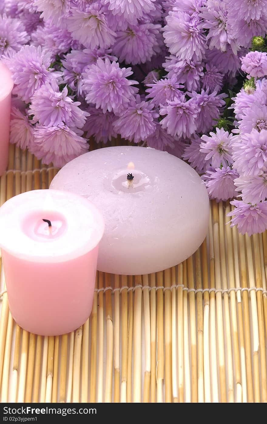 Spa candles and pink flower. Spa candles and pink flower