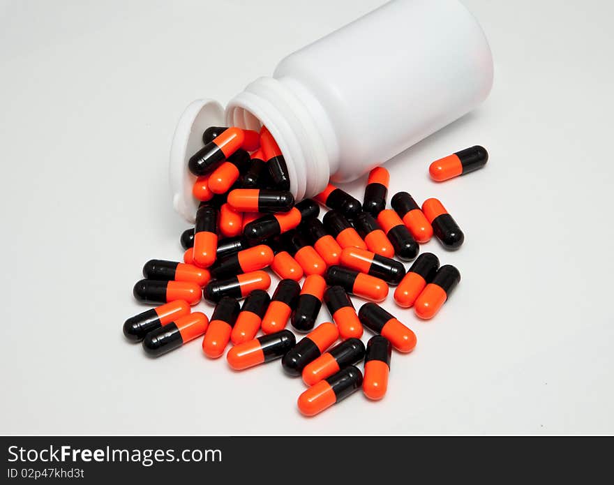 A pile of capsule on an isolated background. A pile of capsule on an isolated background.