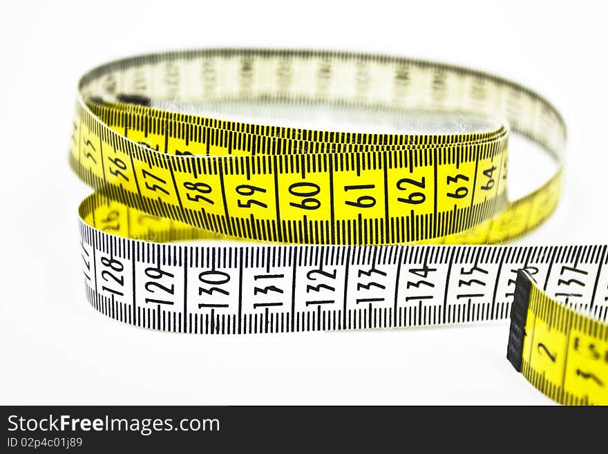 It is a yellow tape measure in a isolated background