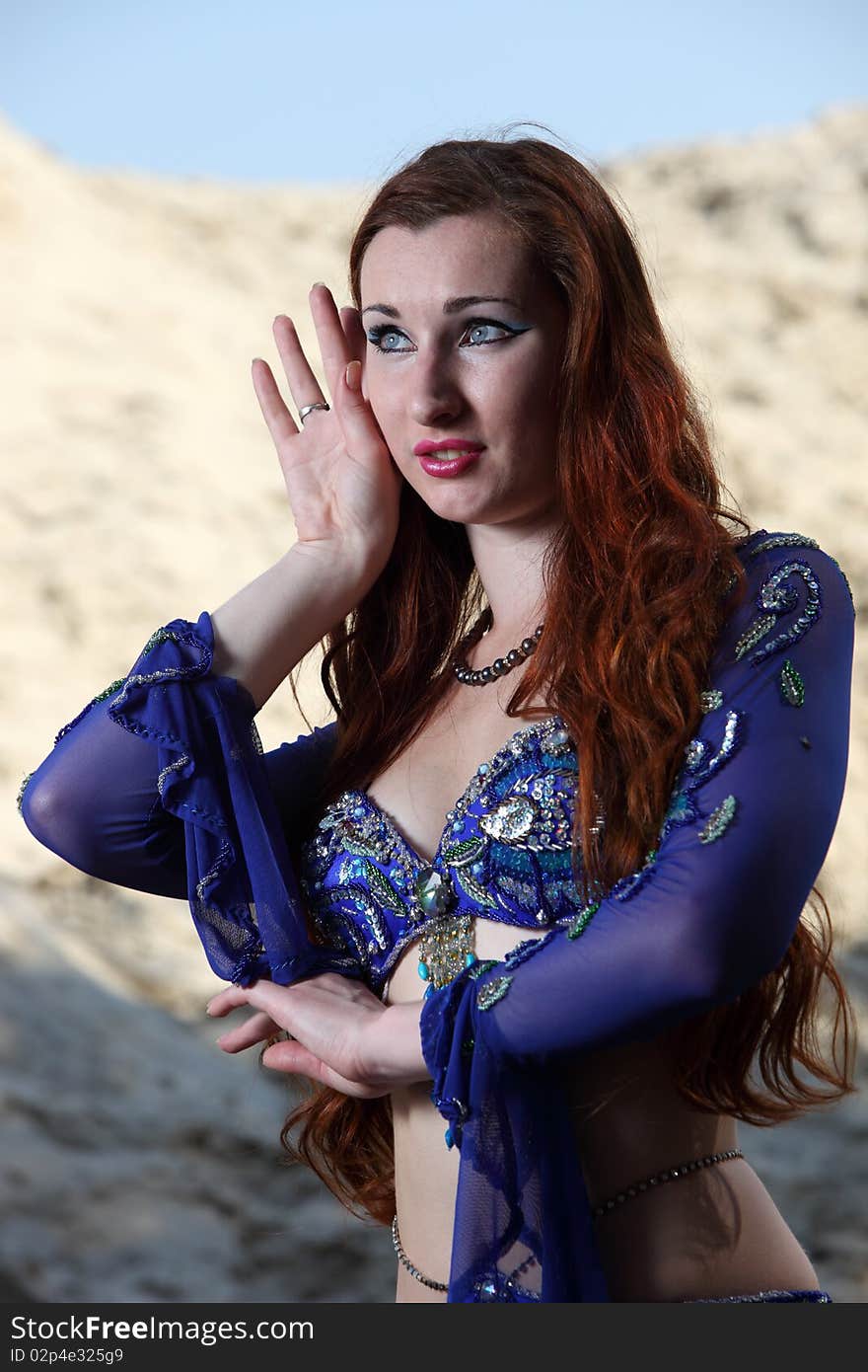 Belly dancer on the sand