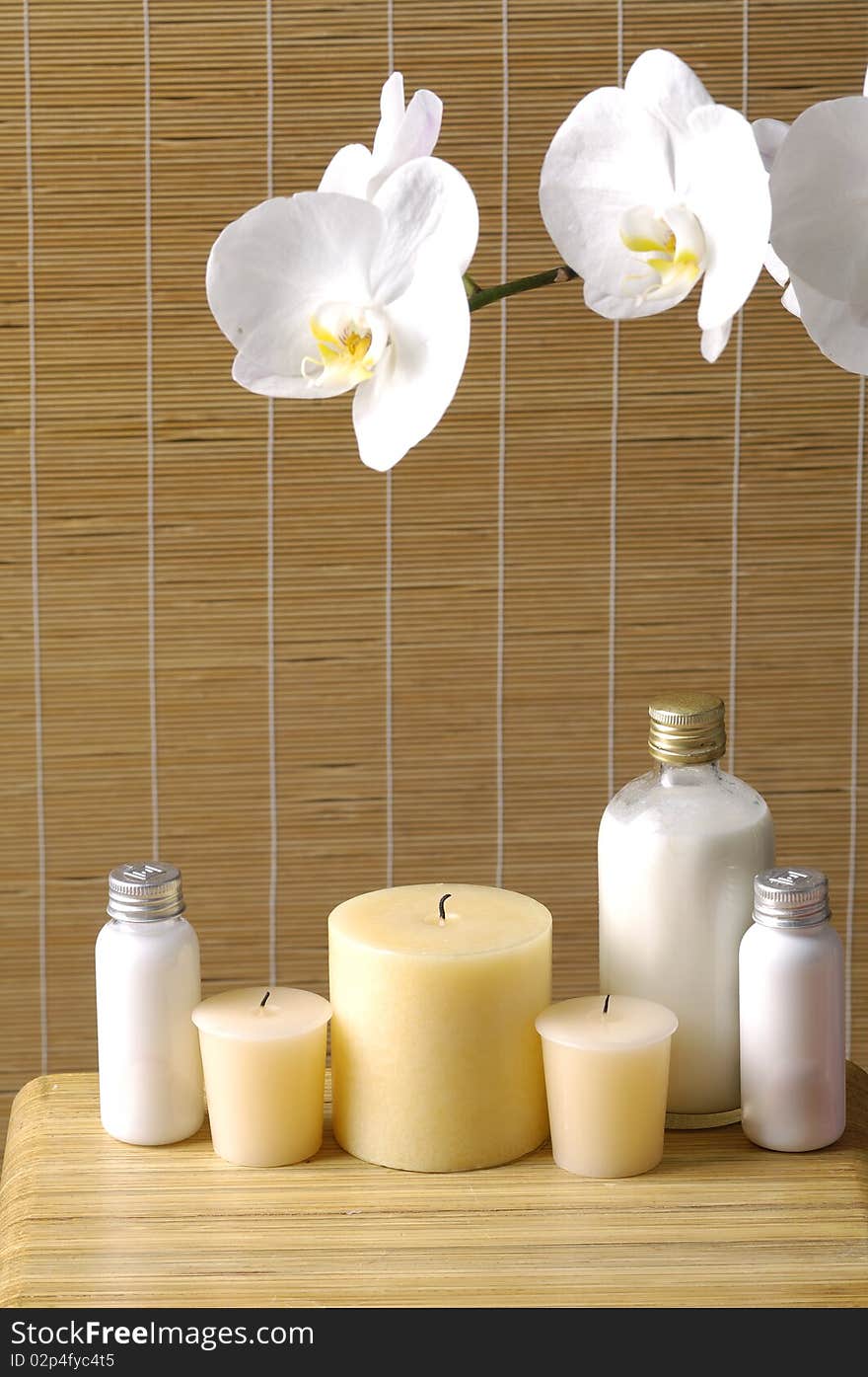 Relaxing spa with candles orchids ,oils on wooden background. Relaxing spa with candles orchids ,oils on wooden background