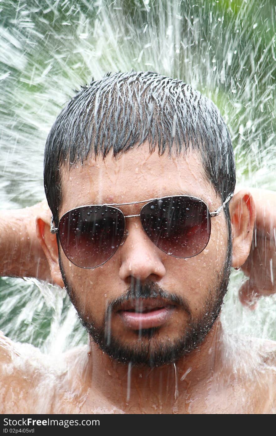 Portrait of a man in water splash. Portrait of a man in water splash