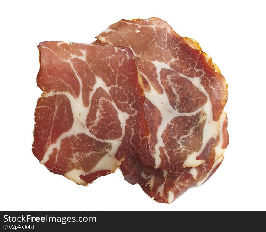 Tasteful slice of ham isolated on white