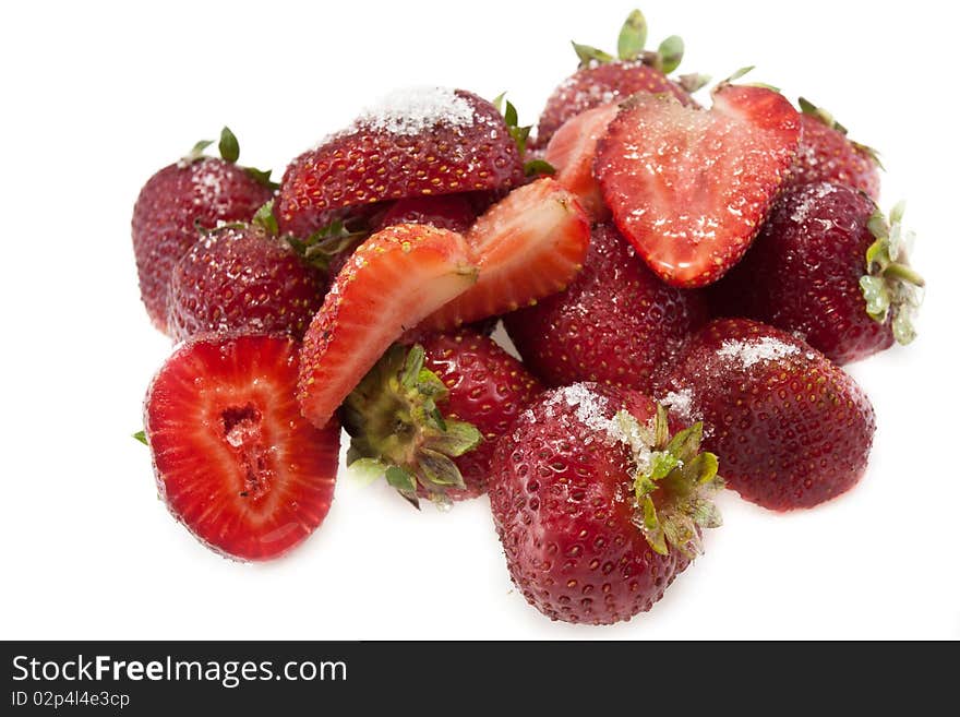 Red juicy strawberries with a little sugar, on white background. Red juicy strawberries with a little sugar, on white background