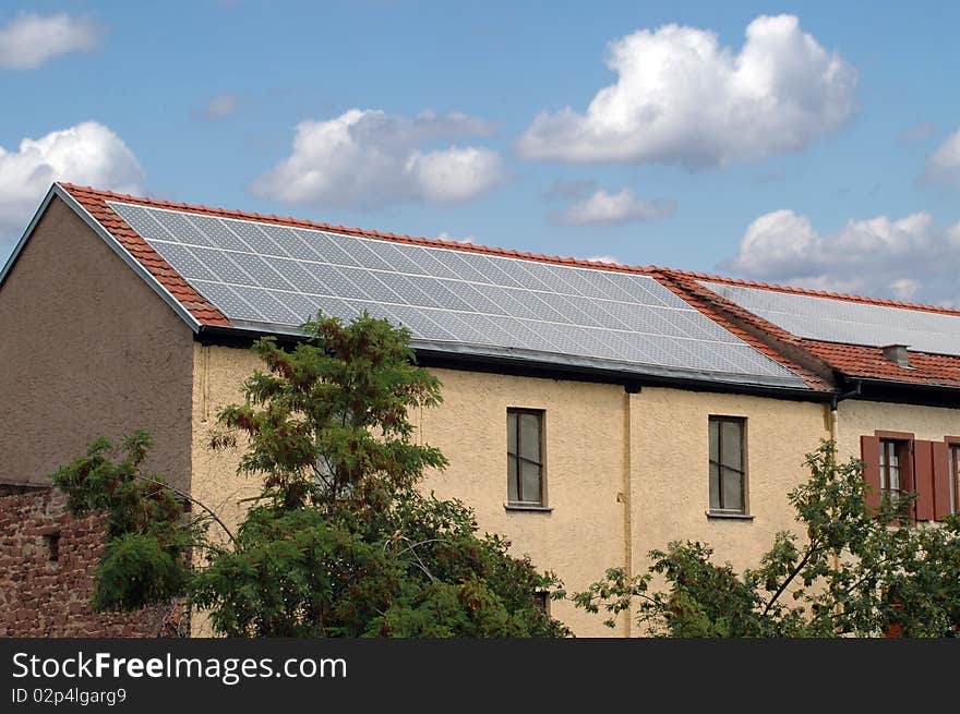 Little house with solar panels on the roof