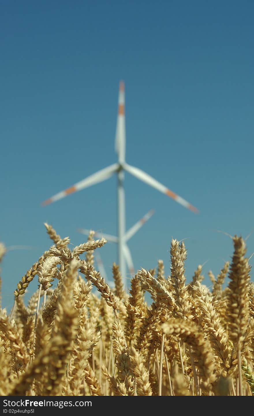 Wind turbine on blue sky background