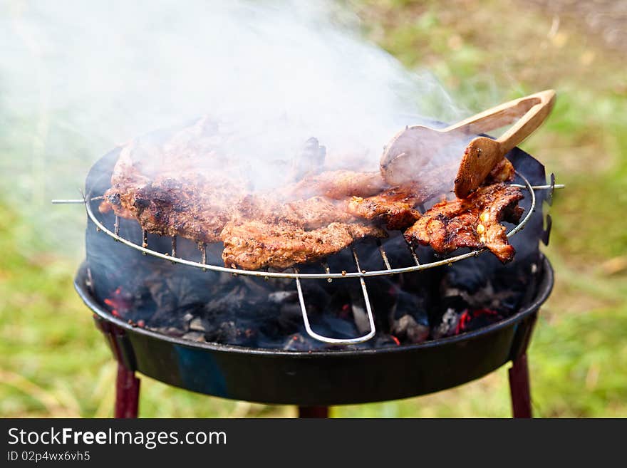 Juicy rib-eye cooking on the grill, nice bit of smoke visible. Juicy rib-eye cooking on the grill, nice bit of smoke visible.