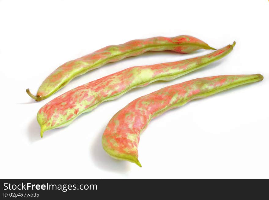 Three bright pink and green whole bean pod color on a white background. Three bright pink and green whole bean pod color on a white background