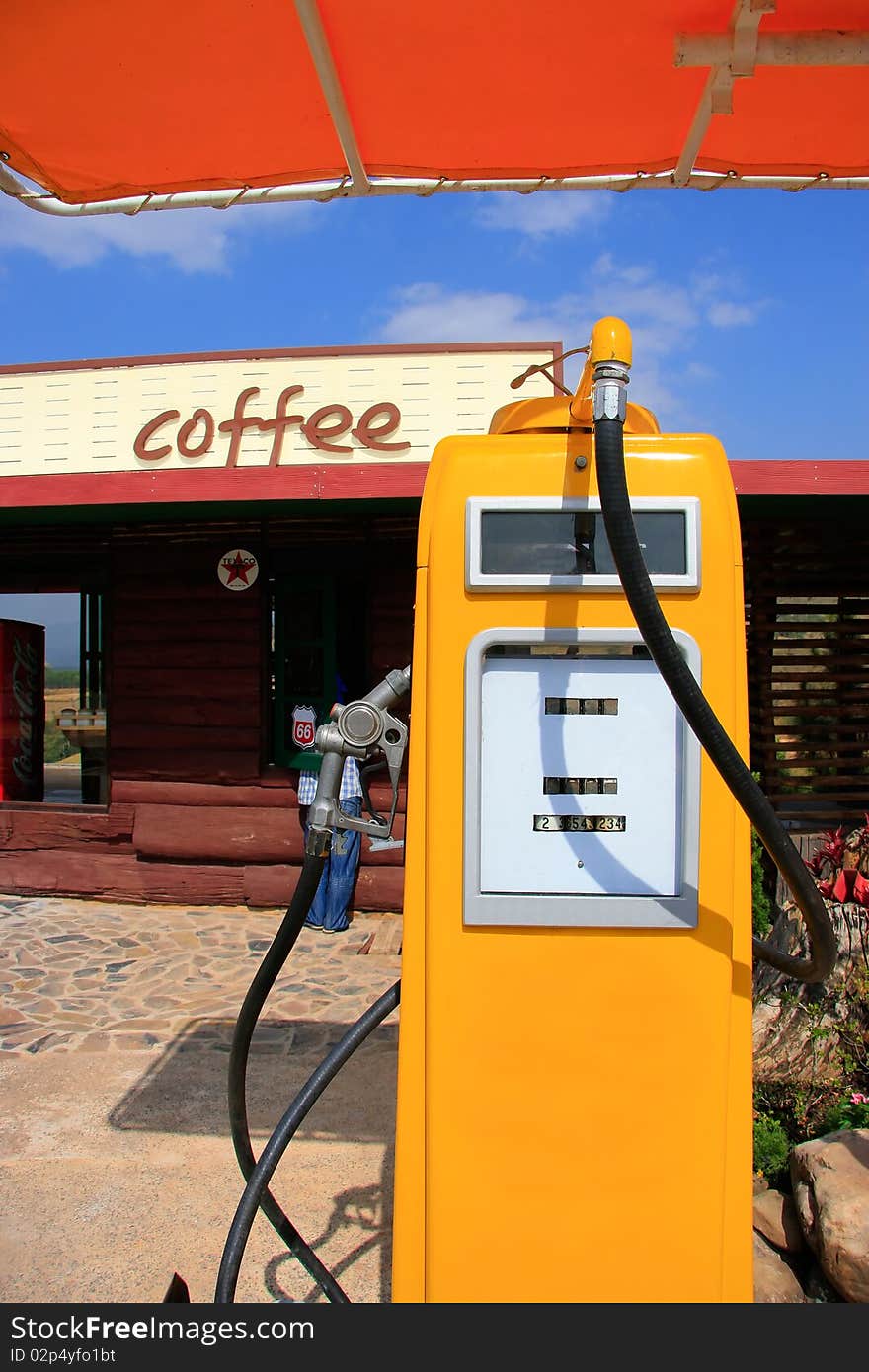 Antique yellow gas station at a coffee shop. Antique yellow gas station at a coffee shop.