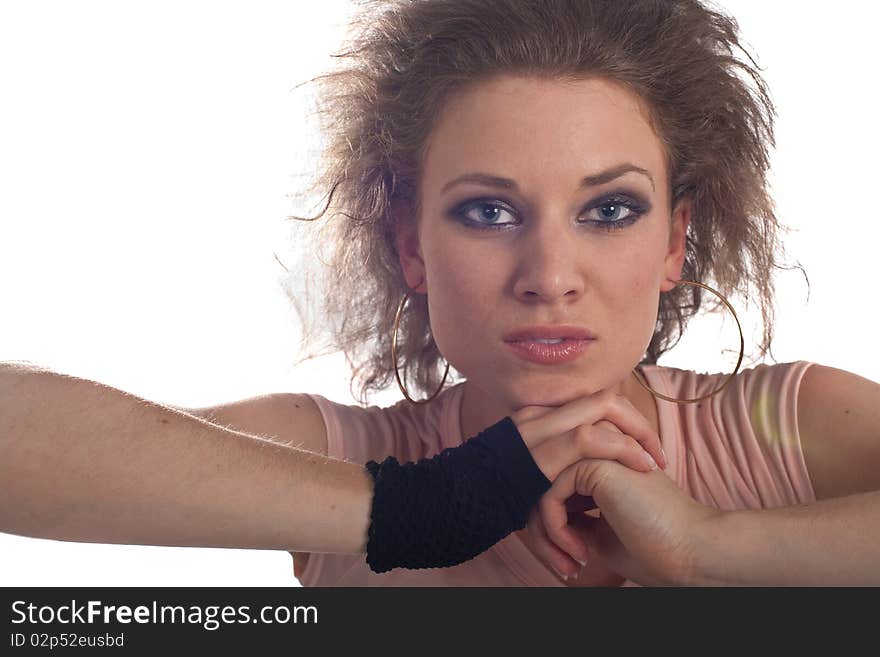 Young fashion model with her hands at her head. Isolated over white.