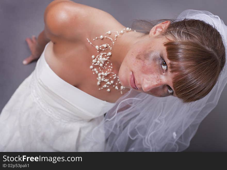 Crying and frustrated bride sitting on the ground. Crying and frustrated bride sitting on the ground