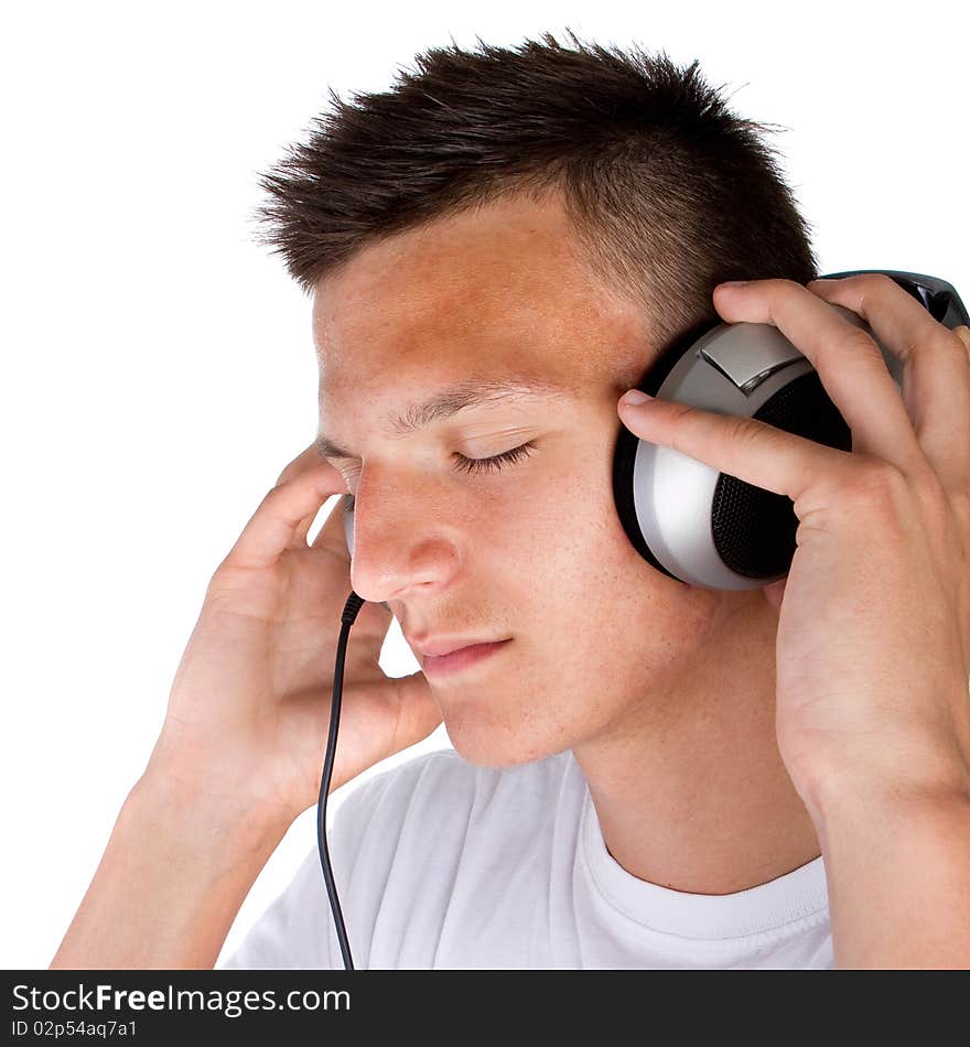 Young fresh teenager with headphones isolated over a white background. Young fresh teenager with headphones isolated over a white background.