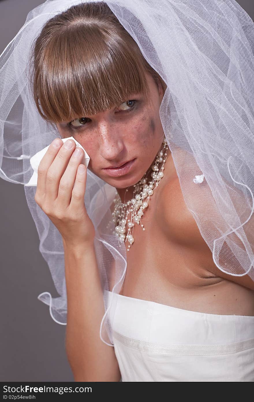 Crying bride with handkerchief