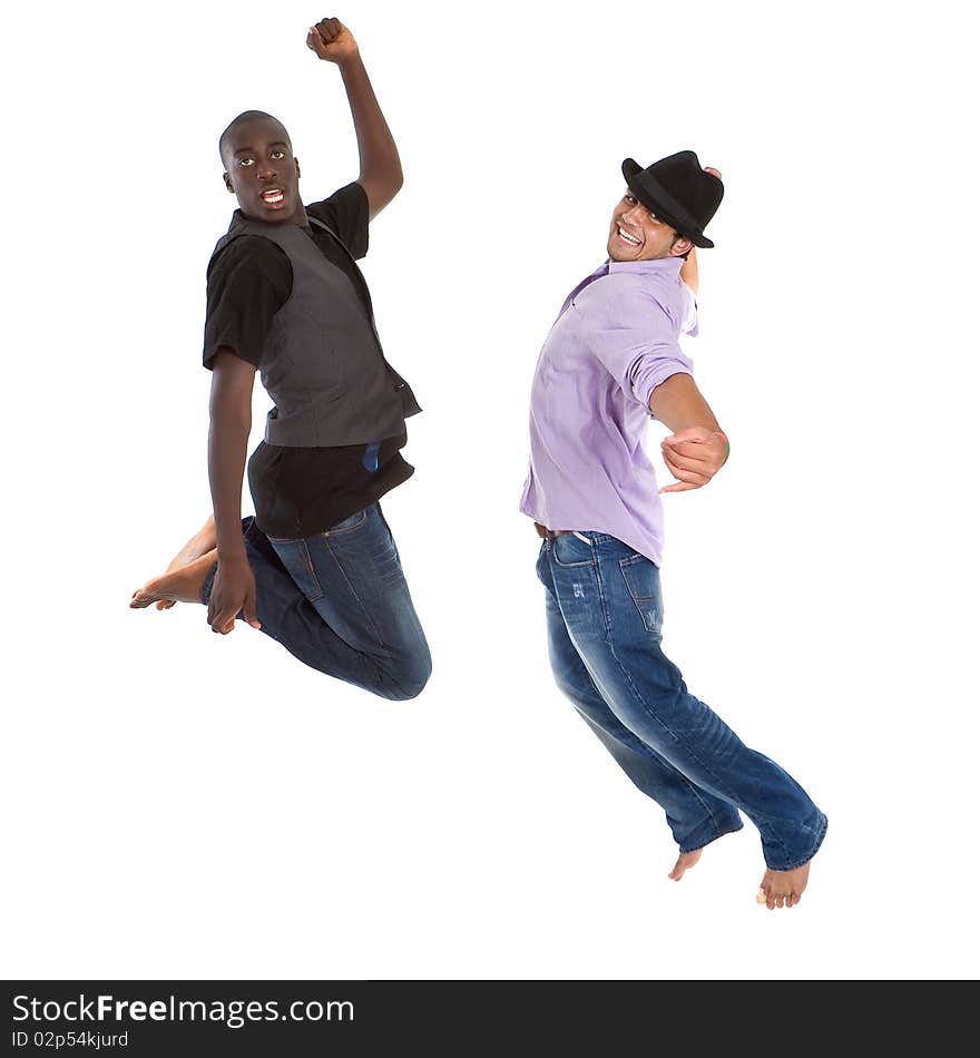 Young group of teenagers with trendy clothes jumping in joy over white background. Young group of teenagers with trendy clothes jumping in joy over white background.