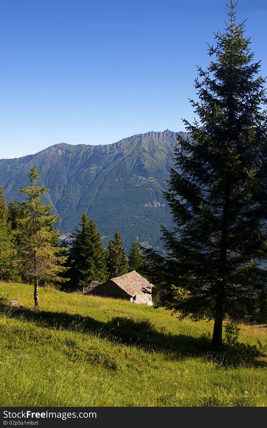 Mountain house in the middle of the lawn. Mountain house in the middle of the lawn