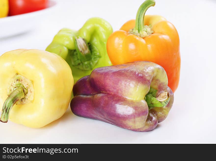 Purple, yellow, orange & green baby bell peppers