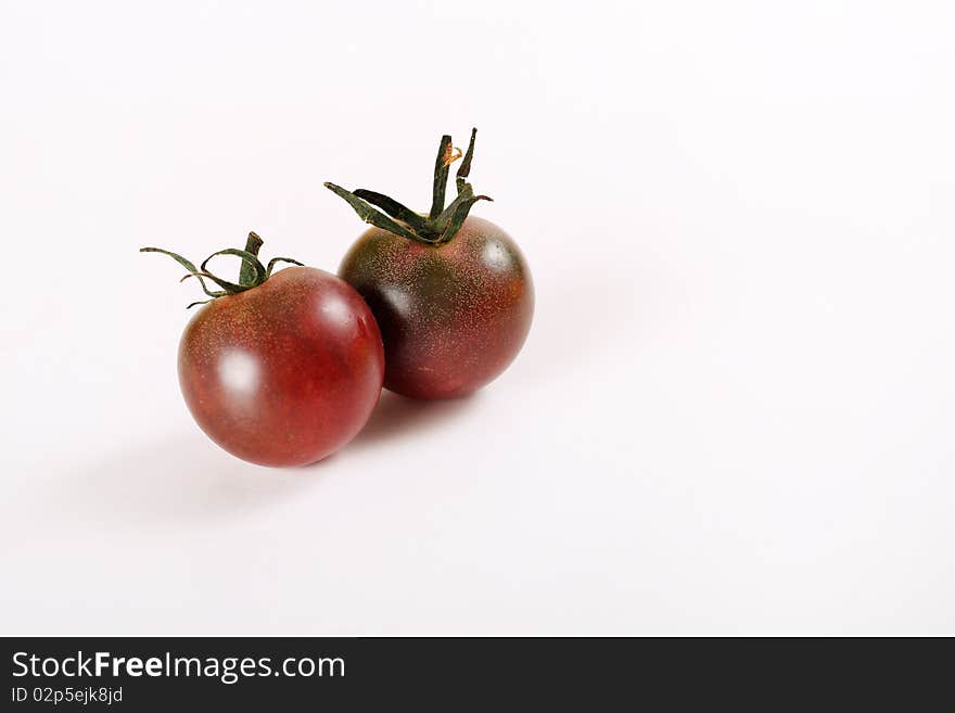 Tiny heirloom deep purple cherry tomatoes