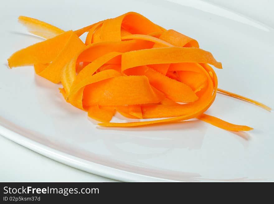 Slices of carrots on a white plate