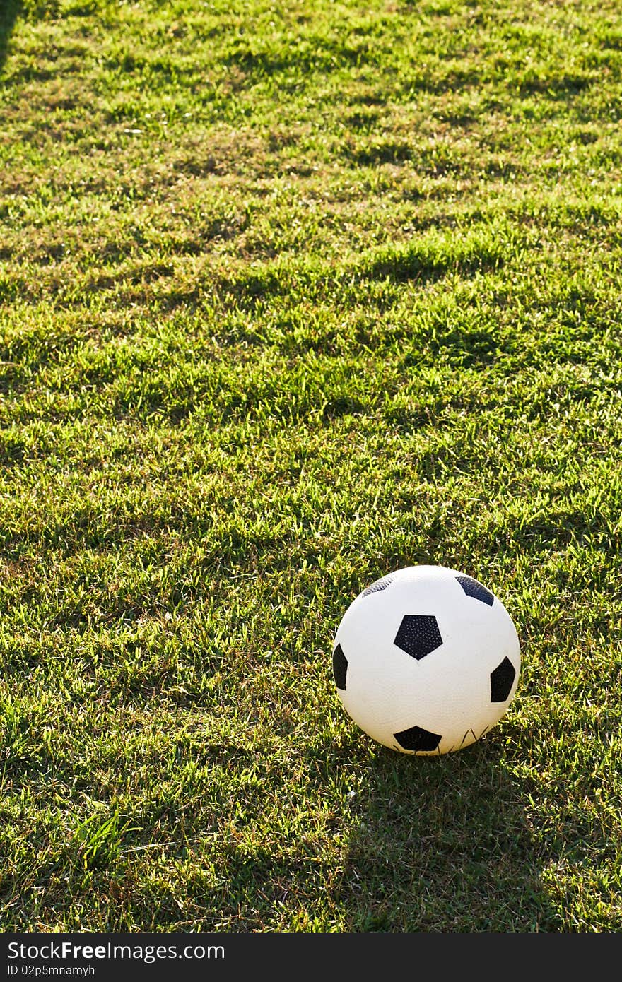 Football is placing on the football field waiting for someone kick off. Football is placing on the football field waiting for someone kick off