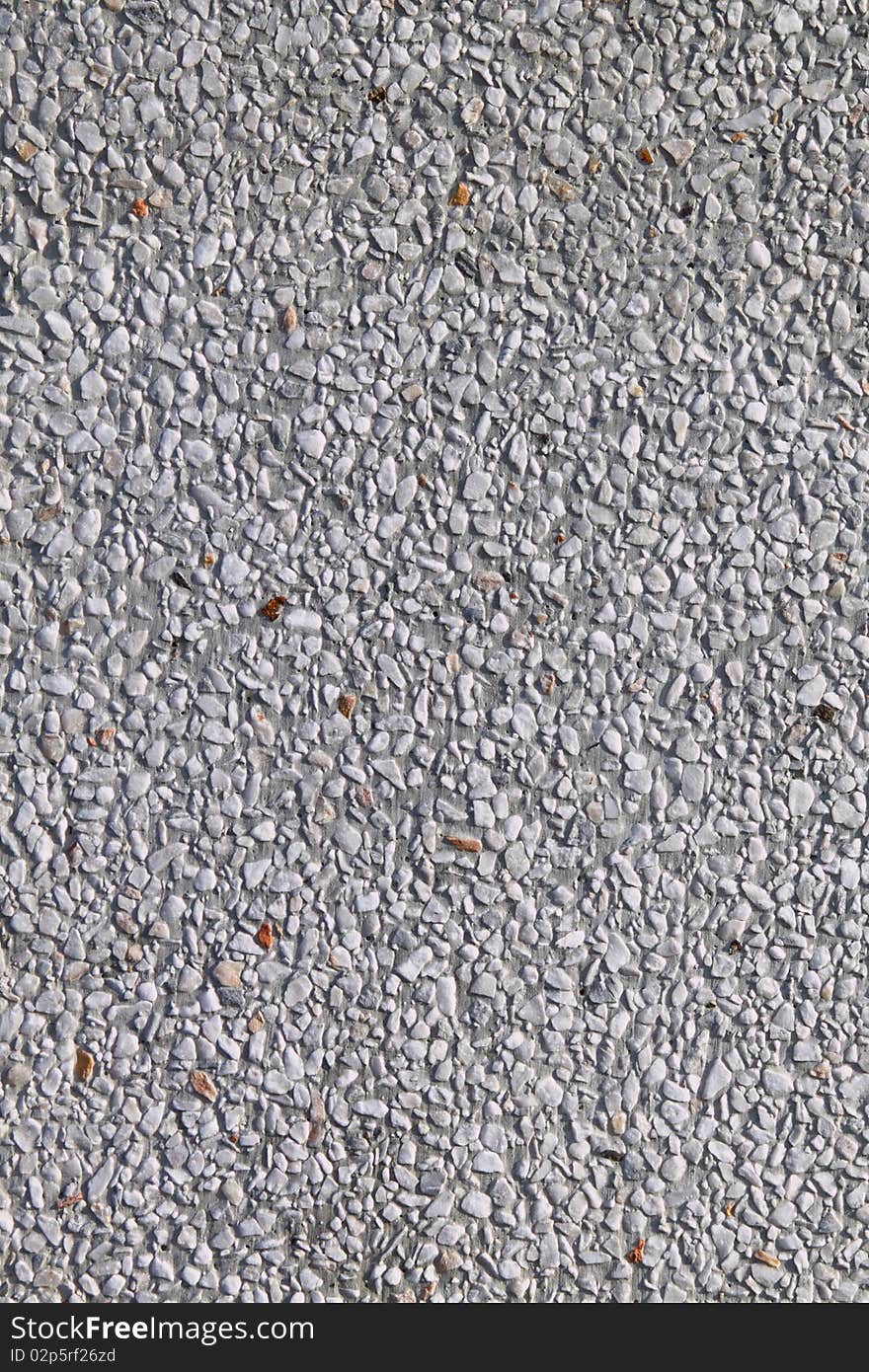 White gravelly  and concrete wall render