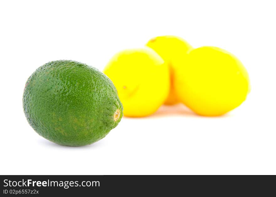 A group of one limes and three lemons on a white background. A group of one limes and three lemons on a white background