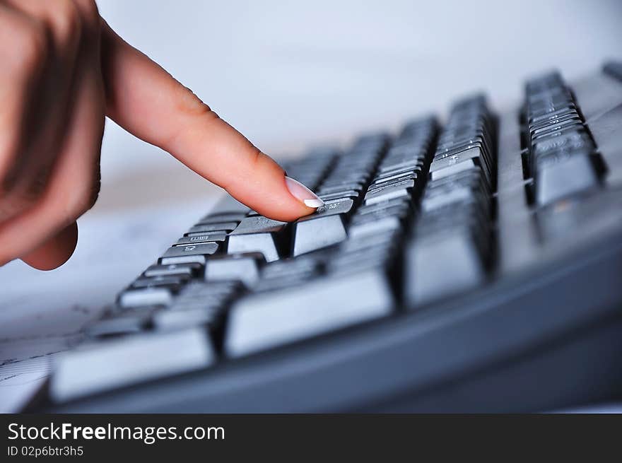 Hands of a young woman presses the keyboard. Workplace businessman