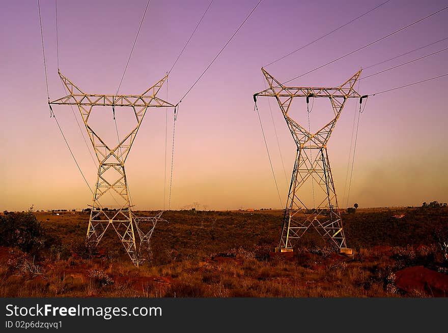 Sunset landscape with two Electrical Pylons