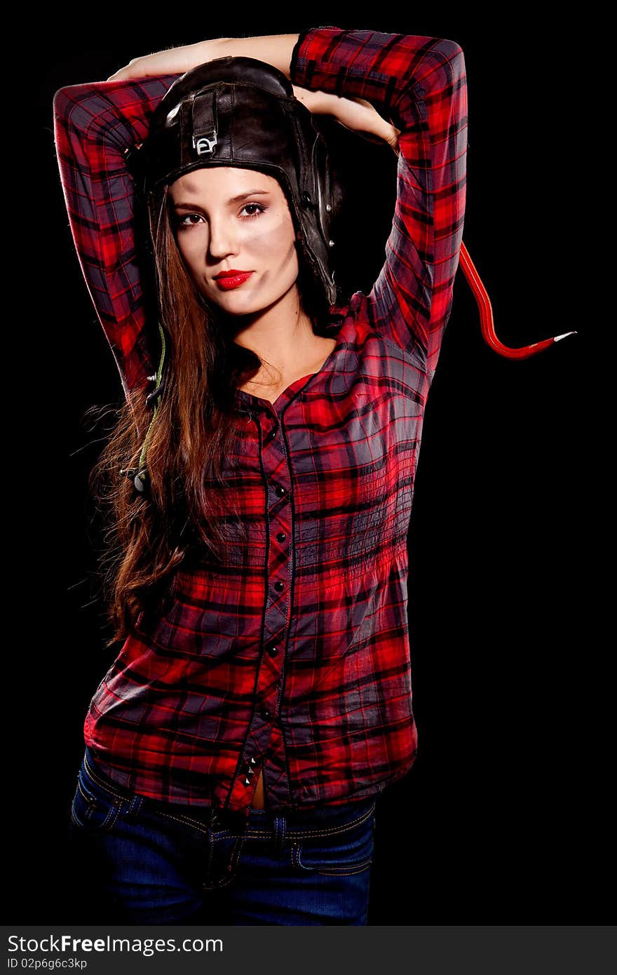 Young beautiful woman in cell shirt with red crowbar. Young beautiful woman in cell shirt with red crowbar