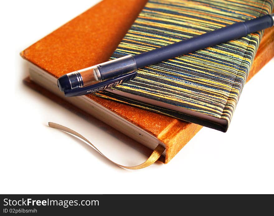 Notebooks and pen on white background. Notebooks and pen on white background