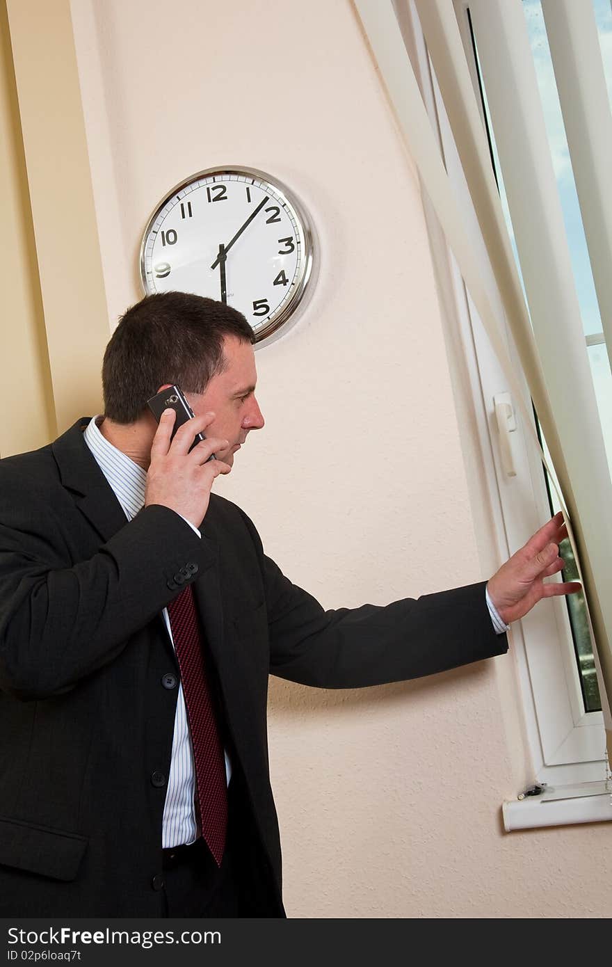 Successful businessman talking on a cell phone. Successful businessman talking on a cell phone