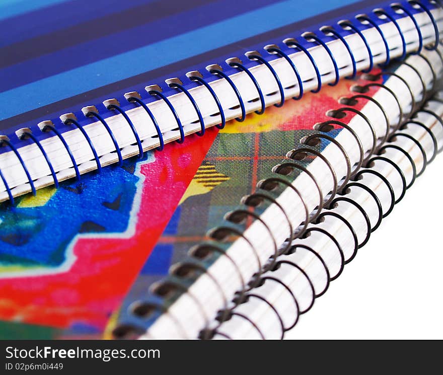 Colored notebooks on white background