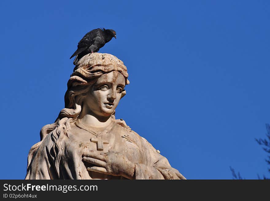 Statue of Mariana Pineda with a pigeon. Mariana Pineda was a martyr during the Spanish Civil War. Statue of Mariana Pineda with a pigeon. Mariana Pineda was a martyr during the Spanish Civil War.