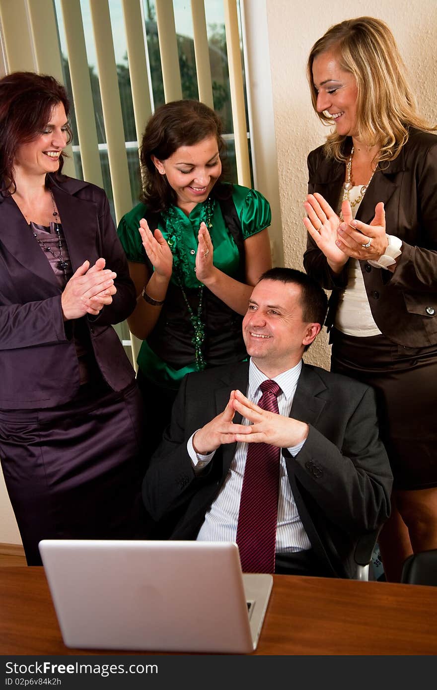 Business man making a presentation, women applauding