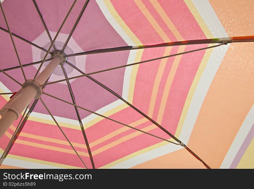 Under of colorful beach umbrella