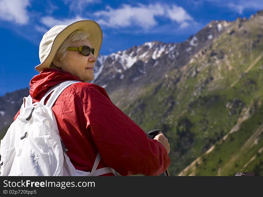 Old women with mountains flowers. Old women with mountains flowers