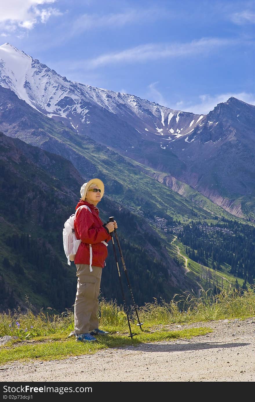 Old women with mountains flowers. Old women with mountains flowers