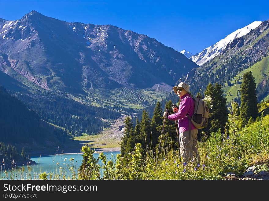 Old women with mountains flowers. Old women with mountains flowers