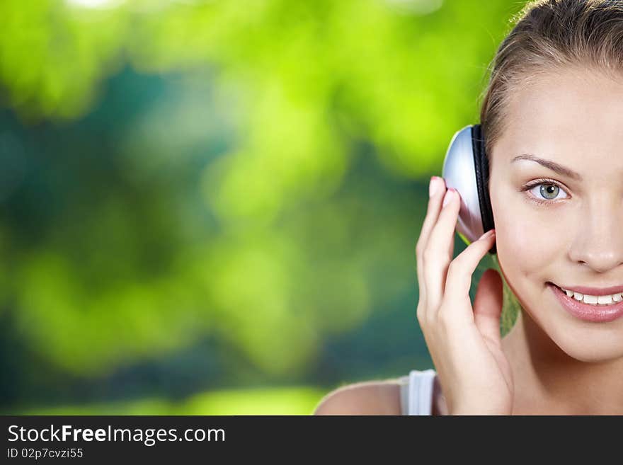 A pretty young girl with headphones. A pretty young girl with headphones