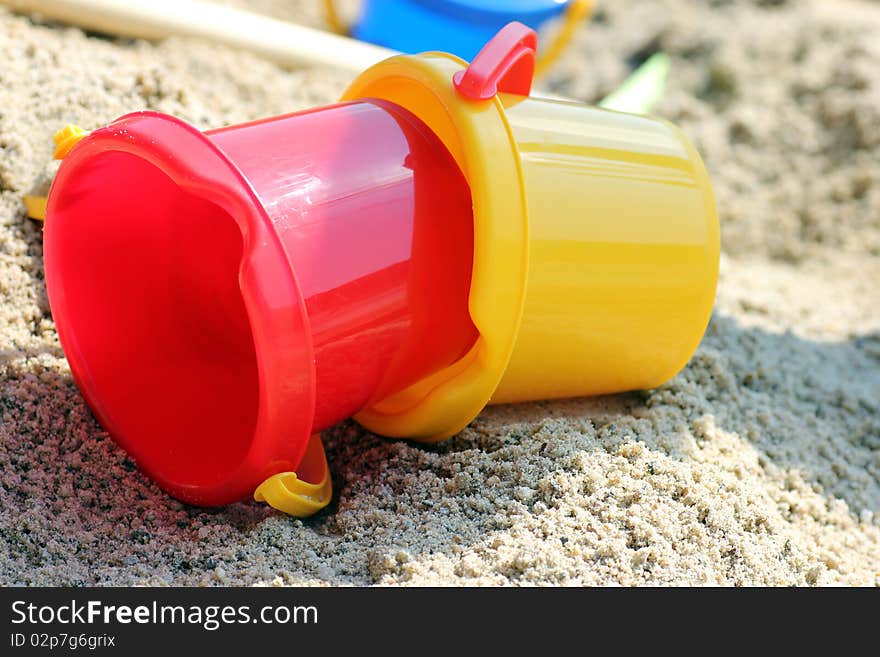 Toys left lying in the sand